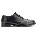 Executive Ghillie Brogues displayed on a wooden surface, emphasizing their timeless style and versatility.