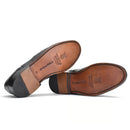 Stylish Day Brogues displayed on a wooden surface, emphasizing their timeless elegance and craftsmanship.
