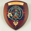 MacLennan Clan Crest Plaque presented against a rustic wooden background showcasing its unique handmade design from Scotland.