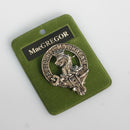 MacGregor Clan Crest Badge in Pewter featuring a traditional design ideal for showcasing clan pride. Crafted from durable palladium coated pewter, sized at 40mm (1.75") for wearing as a cap badge or brooch pin.