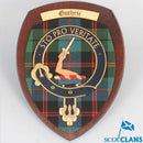 Guthrie Clan Crest Plaque displayed on a wooden surface, showcasing the detailed craftsmanship and unique tartan design, ideal for gift giving.