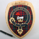 Close-up view of the MacDonald Clan Crest Plaque, featuring intricate patterns and textures, handmade to order with customizable tartan options for true Scottish heritage.