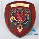 Crawford Clan Crest Plaque displayed on a wall, showcasing its intricate craftsmanship and vibrant colors of the clan tartan.