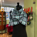 Extra Long Hebridean Scarf - Choice of Tartans worn as a shawl, demonstrating versatility and timeless Scottish textile craftsmanship.