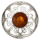 Close-up view of the Culloden Plaid Brooch showcasing its intricate plaid design and sparkling gemstone.
