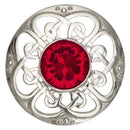 Elegant display of the Culloden Plaid Brooch on a textured background, highlighting its craftsmanship and timeless design.