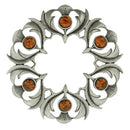 Close-up view of the Antique Scottish Thistle Plaid Brooch with intricate details highlighting the beautiful thistle design and vibrant stones.