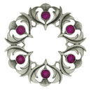 Elegant Antique Scottish Thistle Plaid Brooch worn on a jacket, demonstrating its versatile style and classic Scottish charm.