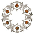 Scottish Thistle Plaid Brooch - Small Stones worn on a jacket, showcasing its elegant design and versatility as a stylish accessory.