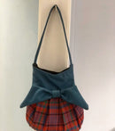 The Effie Bag - Custom made in your choice of tartan displayed in a stylish setting, highlighting its functionality.