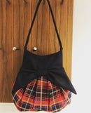 The Effie Bag - Custom made in your choice of tartan showcasing its vibrant colors and stylish design.