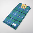 Douglas Ancient Tartan Wool Headscarf elegantly draped, showcasing its vibrant colors and fringe detail, perfect for stylish warmth this season.