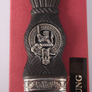 Close-up of the Young Clan Crest Sgian Dubh - Stone Top with a sparkling gold foil backed stone and intricate thistle design.