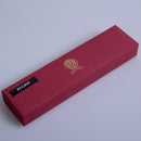 Elliot Clan Crest Sgian Dubh - Stone Top featuring a gold foil backed, multi-faceted cut gem and intricate thistle design on the metalwork, showcasing traditional Scottish craftsmanship.