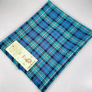 Forbes Ancient Tartan Shawl displayed elegantly, showcasing its intricate design and high-quality wool fabric.