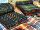Medium Weight Swatches from Lochcarron showcasing various tartan patterns and colors for custom kilts, perfect for choosing the ideal fabric.