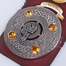 Close-up view of the Makgill Clan Crest Pewter Plaid Brooch showcasing intricate Celtic design and vibrant colored stones.