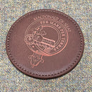 Clan Crest Leather Effect Coaster set featuring four stylish coasters, perfect for showcasing your Scottish heritage and protecting surfaces from heat and moisture.