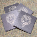 Clan Crest Slate Coaster - Pack of Four featuring stunning engraved family crest designs on durable slate material, perfect for home decor and protecting surfaces.