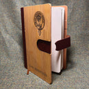 Stylish Clan Crest Luxury Bamboo Covered Notebook placed on a desk demonstrating its sleek leather finish and card wallet feature