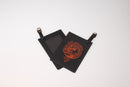 Close-up view of the MacThomas Clan Crest Engraved PU Leather Luggage Tag, highlighting the fine details of the engraving and the quality of the PU leather material.