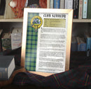 Kennedy Clan History Print displayed in a stylish frame, featuring the clan crest and tartan design, perfect gift option from ScotClans.