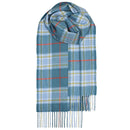 A model wearing Bowhill Standard Tartan Lambswool Scarves, perfect for adding warmth and Scottish charm to any winter outfit.