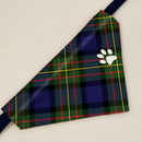 MacLaren Modern Tartan Pet Bandana on a fluffy dog, showcasing the vibrant tartan pattern and adjustable fit for stylish walks.