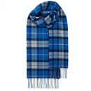 Fashionable look featuring the Bowhill Standard Tartan Lambswool Scarf worn stylishly, perfect for winter outfits.
