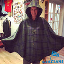 Tartan Cape showcasing over 500 unique tartan patterns, styled elegantly in a warm setting.