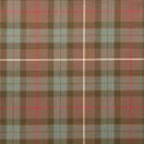 The Laird Hooded Scarf Cape with a vibrant tartan pattern, showcasing its elegant design and versatility.