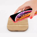Close-up of the Clan Crest Bamboo Wireless Phone Charger, highlighting its eco-friendly bamboo material and stylish charging pad features.