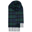 Model wearing a Bowhill Standard Tartan Lambswool Scarf, exemplifying style and warmth in a winter setting.