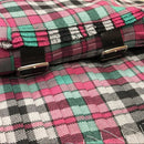 Close-up of the Borthwick Ancient Heavyweight Hand Stitched Kilt fabric, highlighting the intricate hand stitching and rich colors of the tartan.