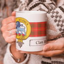 Bruce Clan Crest and Tartan Mug showcasing clan pride, perfect for sipping your favorite beverage.