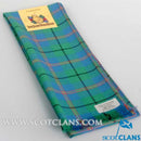 Wool Scarf in Carmichael Ancient Tartan displayed in a casual outdoor setting, showcasing its lightweight design and vibrant colors, perfect for fashion or warmer climates.