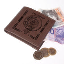 Carnegie Clan Crest Real Leather Wallet displayed on a rustic wooden table showcasing its premium quality leather and personalized engraving.