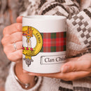 Chisholm Clan Crest and Tartan Mug showcasing clan pride, perfect for hot beverages, 11 oz size.