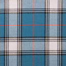 Lightweight Tartan by the meter G-L being used in a sewing project, showcasing its versatility and elegance in fashion design.