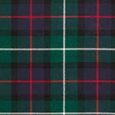 Cozy look at The Laird Hooded Scarf Cape draped stylishly, highlighting the premium lightweight tartan fabric.