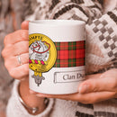 Dunbar Clan Crest and Tartan Mug featuring a vibrant design, perfect for showcasing your clan pride. Ideal for everyday use or as a special gift.