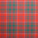 Man wearing a Springweight Wool Tartan Tie, pairing it with a dress shirt for a polished look.