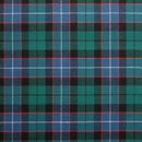 Man wearing a Springweight Wool Tartan Tie in a classic plaid design, demonstrating versatility in style for various outfits.