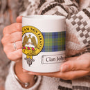 Johnstone Clan Crest and Tartan Mug showcasing Clan pride, perfect for enjoying your favorite beverages.