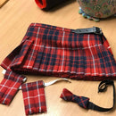 Wee Kiltie in various tartan patterns, illustrating the customization options available for children aged birth to 4 years.