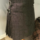 Close-up detail of the Ladies Hand Stitched Tweed Kilt highlighting the hand-stitching and texture.