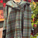 The Laird Hooded Scarf Cape displayed neatly, offering customizable tartan options to suit personal style and heritage.