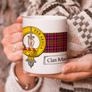 MacIntyre Clan Crest and Tartan Mug - A stylish 11 oz mug featuring the MacIntyre clan crest and tartan design, perfect for showcasing your clan pride.