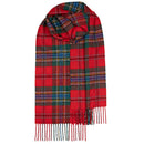 Person wearing a Bowhill Standard Tartan Lambswool Scarf wrapped snugly for warmth and style during a cold day.