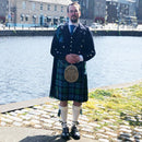 Prince Charlie Kilt Outfit featuring a heavy weight kilt and clan crest accessories, showcasing traditional Scottish attire.